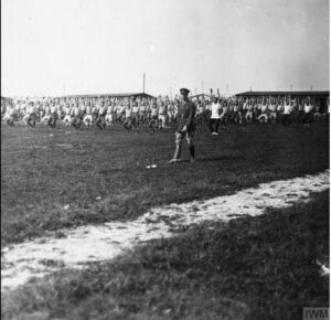 Recruits engaged in Physical Training (Swedish Drill) at a Royal Artillery training camp in England.